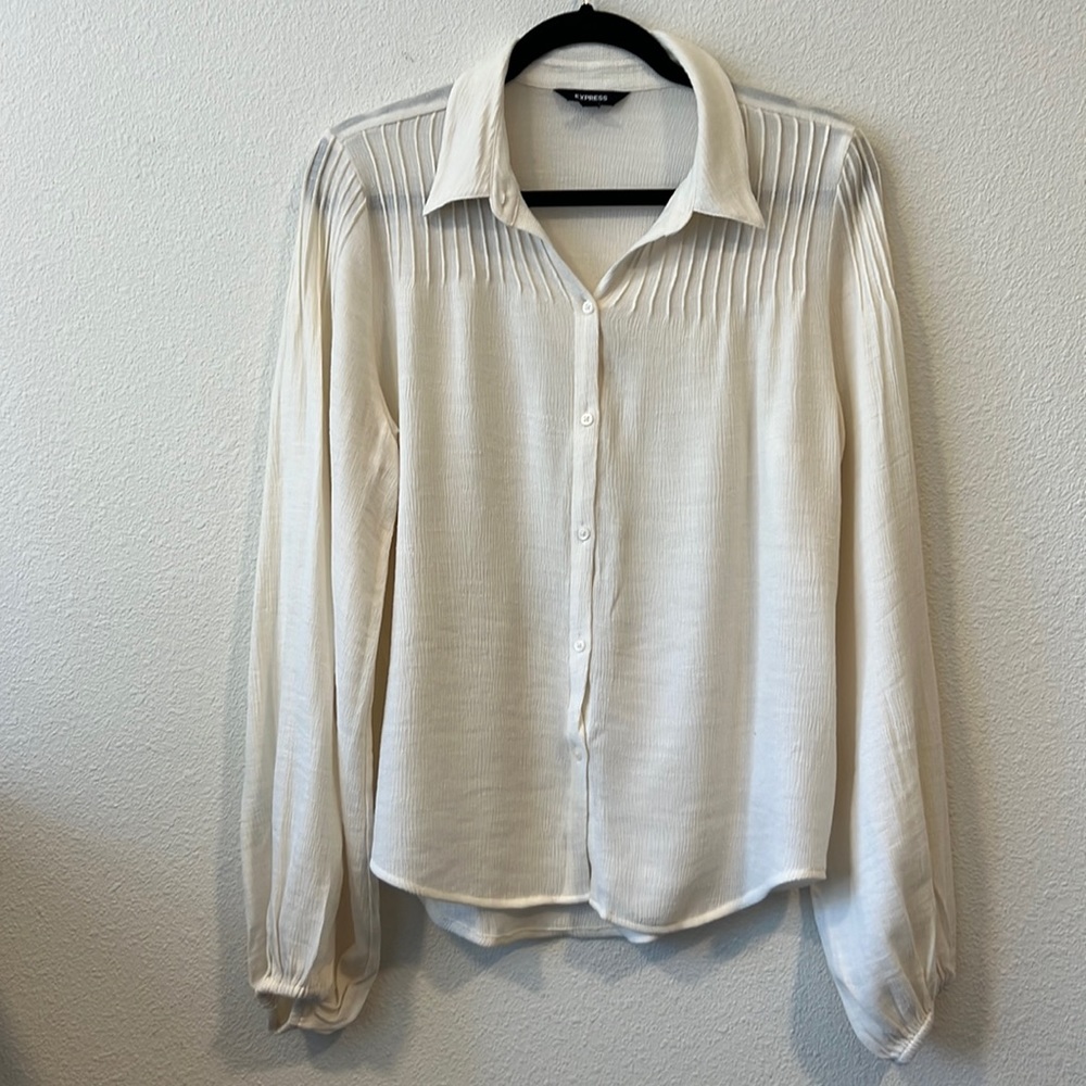 Express Work top with great details and great shape but shrank in the wash.
